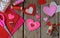 Making pink and red hearts of felt with your own hands. Valentine`s Day background. Valentine gift making, diy hobby. Children`s