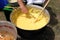 Making polenta in caldron traditional recipe