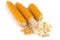 Making popcorn at home: corn on the cob well dried are white, a few grains are separated and lie side by side, the finished