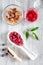 Making raspberry jam. Berries and sugar on grey wooden background top view