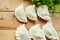 Making Russian dumplings with parsley.