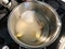 Making Sherbet with Cinnamon Stick, Lemon Peel and Water in Pot for Pasteis de Nata or Belem Tart. Portuguese Custard made with