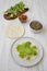 Making shrimp tacos on white wooden background, high angle view. Mexican kitchen