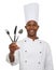 Making sure youre ready to eat. Portrait of an african chef holding eating utensils.