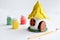 Making toys with your own hands, paints a clay house with gouache. Indoors creative leisure for children. Supporting creativity,