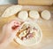 Making traditional pastries with potatoes and meat