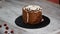 Making trendy rustic vertical roll high cake with chocolate, vanilla cream and raspberries.