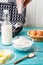 Making waffles at home. Pouring flour into a bowl