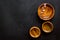 Making wooden dishes. Empty bowls on black background top view copy space