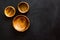Making wooden dishes. Empty bowls on black background top view copy space