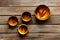 Making wooden dishes. Empty bowls on dark wooden background top view copy space