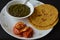 Makki di Roti and Sarson da saag with pickle.Mustard greens cooked until creamy, butter and crispy and soft yellow cornmeal roti.