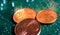 Makro close up of isolated glowing blurred pile euro cent coins on green motherboard