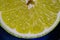 Makro close up of shiny fruity yellow citron slice