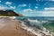 Makua beach view of the wave with beatiful mountains and a sailboat in the background