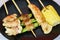 MALA Chinese BBQ - Grilled pork thai asian street food style slice pork with vegetable mushroom corn in skewer sticks grilled on