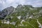 Mala Spice Cime Verdi peaks view from Mangart saddle, Slovenia\\\'s Highest Panoramic Road, heavy clouds before rain, foggy day