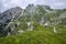 Mala Spice Cime Verdi peaks view from Mangart saddle, Slovenia\\\'s Highest Panoramic Road, heavy clouds before rain, foggy day