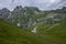 Mala Spice Cime Verdi peaks view from Mangart saddle, Slovenia\\\'s Highest Panoramic Road, heavy clouds before rain, foggy day