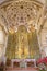 Malaga - The presbytery and main altar with the statue of st. Jacob the Apostle in church Iglesia del Santiago Apostol