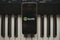 MALAGA, SPAIN - APRIL 12 th, 2018: Spotify Streaming music app in an iPhone screen, placed on a vintage musical keyboard.
