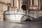 Malaga, Spain, February 2019.Two girls relax on the marble steps of the famous Malagan Incarnate Cathedral and eat ice cream.