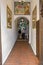 MALAGA, SPAIN - September 2nd, 2018: Senior couple walking across the corridor of the popular restaurant El Pimpi, the most famous