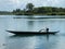 Malagasy child steering canoe