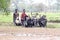 Malagasy farmers plowing agricultural field in traditional way