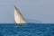 Malagasy fisher on sea in traditional handmade dugout wooden sailing boat