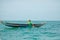 Malagasy fisherman on wooden old pirogue