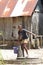 Malagasy girl goes for water to a public pump, Madagascar