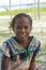 Malagasy girl portrait smiling with a tropical beach background