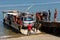 Malagasy peoples loading ship in Nosy Be, Madagascar