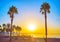 The Malagueta beach with silhouettes of palms and Malagueta sign, on Sept 29 in Malaga, Spain