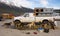 Malamutes waiting to be loaded onto a helicopter in alaska