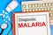 Malaria. The text label of the medical diagnosis.