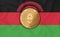 Malawi flag  ethereum gold coin on flag background. The concept of blockchain  bitcoin  currency decentralization in the country.