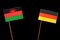 Malawi flag with German flag isolated on black