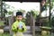 A Malay boy in Malay traditional cloth showing his happy reaction after received money pocket during Eid Fitri or Hari Raya celebr