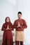 Malay couple smile with gestures of apology when wish Happy Ramadan Kareem