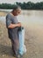 A malay fisherman catch fish using net at river in Malaysia