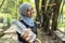 Malay Muslim lady wearing hijab outdoor resting and drink water