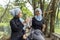 Malay Muslim lady wearing hijab outdoor resting and drink water