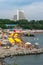 Malaya Bay in Anapa resort. People rest on stony beach of Black Sea on Malaya Bukhta sanatorium background. Anapa is popular