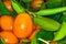 Malayan kumquat fortunella foliage and fruit macro background
