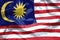 Malaysia Flag background. Closeup of ruffled Malaysia flag blowing in the wind
