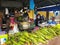 Malaysia - June 2022: Market seller selling freshly steam corn