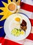 Malaysian Breakfast - Nasi Lemak and Teh Tarik on Malaysia Flag.