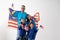 Malaysian family holding malaysia flag over white background